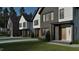 Exterior shot of modern home design with dark brick and light siding at 1800 Pershing Rd, Raleigh, NC 27608
