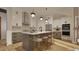Modern kitchen with stainless steel appliances and a central island with seating at 1800 Pershing Rd, Raleigh, NC 27608