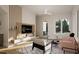 Well-lit living room with modern furnishings and a decorative accent wall with shelving at 1800 Pershing Rd, Raleigh, NC 27608