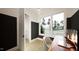 Well-lit office with a large window, modern desk, and a view of the outdoors at 1800 Pershing Rd, Raleigh, NC 27608