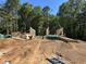 Framing stage of construction featuring lumber, ladder and construction workers on site at 188 Landon Ridge, Sanford, NC 27330