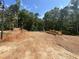 New home construction featuring the completed foundation with wooded views at 188 Landon Ridge, Sanford, NC 27330