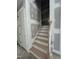 Stairway leading to the second story with painted risers and wooden treads at 188 Landon Ridge, Sanford, NC 27330