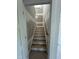 Stairway leading to the second story with painted risers and wooden treads at 188 Landon Ridge, Sanford, NC 27330