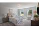 A charming bedroom featuring comfy carpet, neutral walls, and dual windows for ample natural light at 1931 Ballard Rd, Fuquay Varina, NC 27526