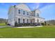 Beautiful two-story home with a spacious lawn and a charming covered front porch at 1931 Ballard Rd, Fuquay Varina, NC 27526