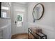 Stylish foyer with a mirror and decorative table by the entrance at 1931 Ballard Rd, Fuquay Varina, NC 27526