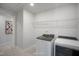 Laundry room featuring modern washer and dryer, and wire shelving at 1931 Ballard Rd, Fuquay Varina, NC 27526