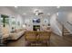 Comfortable living room featuring a fireplace, TV, and staircase at 1931 Ballard Rd, Fuquay Varina, NC 27526