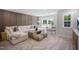 Relaxing living room featuring a plush sectional sofa, rustic wood table, and comfortable seating at 1931 Ballard Rd, Fuquay Varina, NC 27526