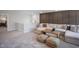 Cozy living room featuring plush seating, a neutral color palette, and a decorative accent wall at 1931 Ballard Rd, Fuquay Varina, NC 27526