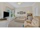Cozy bedroom with neutral decor, a comfortable seating area, and a bright window at 1933 Castle Pines Dr, Raleigh, NC 27604