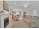 Spacious living room featuring a fireplace, neutral paint, and a glimpse of the dining area beyond at 1933 Castle Pines Dr, Raleigh, NC 27604