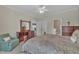 Comfortable main bedroom features en suite bathroom, walk-in closets, wood furniture, and neutral carpet at 1933 Castle Pines Dr, Raleigh, NC 27604
