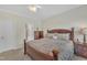 Bedroom with ample natural light, wooden furniture, ceiling fan, carpeted flooring at 1933 Castle Pines Dr, Raleigh, NC 27604