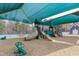 Close up view of the playground area featuring slides, spring riders, and covered shade at 1933 Castle Pines Dr, Raleigh, NC 27604