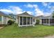 Exterior of a home with a screened porch and a well-manicured lawn at 1933 Castle Pines Dr, Raleigh, NC 27604