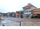 A view of the Crabtree shopping center featuring various stores and restaurants with classic architectural design elements at 1933 Castle Pines Dr, Raleigh, NC 27604