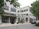 Cameron Clothing Co. on the street corner in a well-maintained shopping center with lush landscaping at 1933 Castle Pines Dr, Raleigh, NC 27604