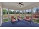 Inviting sunroom with comfortable seating, offering serene views of the expansive lawn at 1933 Castle Pines Dr, Raleigh, NC 27604