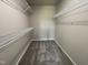 Walk-in closet with gray carpeting and adjustable shelving for optimal storage and organization at 199 Lotus Ave, Smithfield, NC 27577