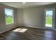 Clean, bright flex room with neutral walls, plank flooring, a large window, and an outdoor access door at 199 Lotus Ave, Smithfield, NC 27577