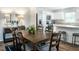 Elegant dining room featuring a large wooden table and view into the kitchen at 201 Tormore Dr, Sanford, NC 27330
