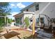 Relaxing backyard oasis with a hammock, patio furniture, and a well-maintained lawn at 208 Station Dr, Morrisville, NC 27560