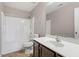Bathroom featuring a tub and shower, a toilet, a vanity, and a large mirror at 208 Station Dr, Morrisville, NC 27560