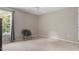 Carpeted bedroom with a ceiling fan and a large window providing natural light at 208 Station Dr, Morrisville, NC 27560