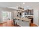 Modern kitchen with granite countertops, stainless steel appliances, and an island at 208 Station Dr, Morrisville, NC 27560