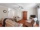 Cozy living room with hardwood floors, comfortable seating, and a ceiling fan at 208 Station Dr, Morrisville, NC 27560