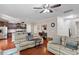 Open concept living room and kitchen with hardwood floors and modern decor at 208 Station Dr, Morrisville, NC 27560