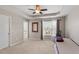 Spacious main bedroom with tray ceiling, large window, and neutral carpeting at 208 Station Dr, Morrisville, NC 27560