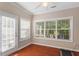 Bright sunroom with lots of natural light and sliding glass door access to the outdoors at 208 Station Dr, Morrisville, NC 27560