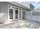 Backyard deck has a white fence and a set of French doors that let in lots of natural light at 2089 White Pond Ct, Apex, NC 27523