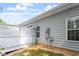 Backyard of the home with white fencing on a sunny day, providing a great space for entertaining at 2089 White Pond Ct, Apex, NC 27523