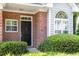 Charming brick home with a well-manicured lawn, unique front door, and bright window at 2089 White Pond Ct, Apex, NC 27523