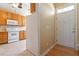 Bright kitchen features wood cabinets, white appliances, tile backsplash, and stone countertops at 2089 White Pond Ct, Apex, NC 27523