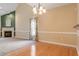 This beautiful living room has a fireplace, high ceilings, and large windows at 2089 White Pond Ct, Apex, NC 27523