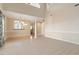 This open concept living room features high ceilings and large windows at 2089 White Pond Ct, Apex, NC 27523