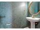 Chic powder room with unique patterned wallpaper, pedestal sink, and a stylish gold-framed mirror at 2089 White Pond Ct, Apex, NC 27523