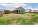 Beautiful backyard with a screened porch, privacy fence, and lush green lawn, perfect for outdoor entertaining at 230 Forest Meadow Ln, Franklinton, NC 27525