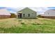 This home features a spacious backyard with green lawn, a fence, and a screened porch at 230 Forest Meadow Ln, Franklinton, NC 27525