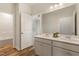 Bathroom featuring double sinks, wood-look floors, and an additional room at 230 Forest Meadow Ln, Franklinton, NC 27525