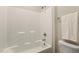 Full bathtub and shower with a white towel and toilet at 230 Forest Meadow Ln, Franklinton, NC 27525