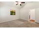 Neutral bedroom with carpeted floors and plenty of natural light, with door leading to ensuite bathroom at 230 Forest Meadow Ln, Franklinton, NC 27525