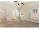 Bedroom with gray carpet, two windows, and access to a closet and the Primary bathroom at 230 Forest Meadow Ln, Franklinton, NC 27525