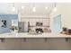 Kitchen island featuring pendant lighting, gray cabinets and stainless steel sink at 230 Forest Meadow Ln, Franklinton, NC 27525