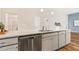 Kitchen island with granite counters and stainless steel dishwasher at 230 Forest Meadow Ln, Franklinton, NC 27525